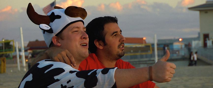 Man in Cow Costume and his friend flash a thumbs up